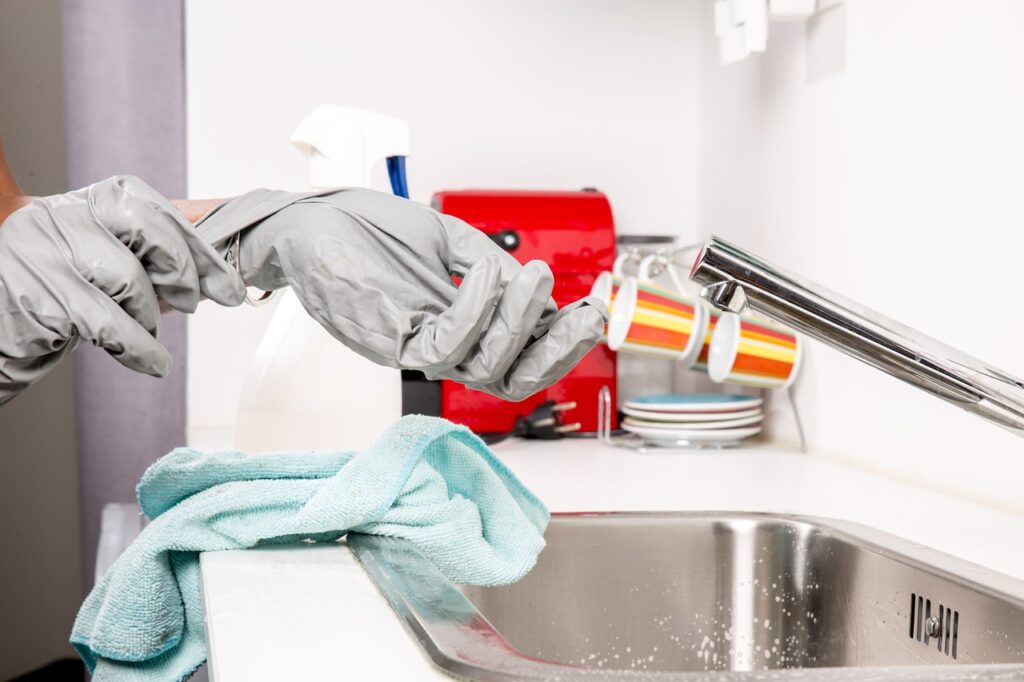 commercial cleaning services in vaughan woman wearing gloves to make sure the cleaning is hygienic